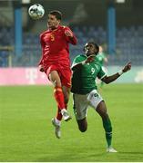 12 October 2021; Anto Babic of Montenegro in action against Joshua Ogunfaolu-Kayode of Republic of Ireland during the UEFA European U21 Championship Qualifier Group F match between Montenegro and Republic of Ireland at Gradski Stadion Podgorica in Podgorica, Montenegro. Photo by Filip Roganovic/Sportsfile