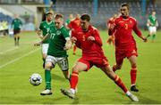 12 October 2021; Ross Tierney of Republic of Ireland in action against Anto Babic of Montenegro during the UEFA European U21 Championship Qualifier Group F match between Montenegro and Republic of Ireland at Gradski Stadion Podgorica in Podgorica, Montenegro. Photo by Filip Roganovic/Sportsfile