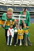 15 March 2004; Pictured ahead of the AIB All-Ireland Club Finals are young fans of the participating clubs Scott Shier, An Ghaeltacht, Rebecca Dore, Caltra, Cian Brannigan, Dunloy and Rachel Dore, Newtownshandrum, with Donal Forde, Managing Director, AIB Bank, Pozza the Clown and two Giant Fans. AIB announced details of the St. Patrick's day entertainment planned for Croke Park on Wednesday, which include teams of face painters and giant GAA fans. Croke Park, Jones Road, Dublin. Picture credit; Ray McManus / SPORTSFILE *EDI*