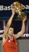 24 March 2004; St. Fintan's captain Isaac Westbrooks lifts the cup after the game. All-Ireland Schoolboys Basketball League, U19 'A'  Final, St FIntan's, Sutton, Dublin v North Monastery, Cork, ESB Arena, Tallaght, Dublin. Picture credit; Brendan Moran / SPORTSFILE *EDI*