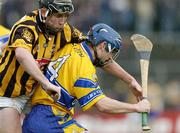 21 March 2004; Gerry O'Grady, Clare, in action against Eddie Brennan, Kilkenny. Allianz Hurling League 2004, Division 1A, Round 4, Clare v Kilkenny, Cusack Park, Ennis, Co. Clare. Picture credit; Ray McManus / SPORTSFILE *EDI*