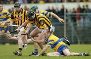 21 March 2004; Ollie Baker, Clare, in action against Martin Comerford, Kilkenny. Allianz Hurling League 2004, Division 1A, Round 4, Clare v Kilkenny, Cusack Park, Ennis, Co. Clare. Picture credit; Ray McManus / SPORTSFILE *EDI*