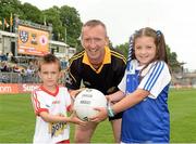 21 July 2013; Aoife McIlroy, from Tydavnet, Co. Monaghan, and Eoin McQuade, from Omagh, Co. Tyrone, are pictured at the Electric Ireland Ulster GAA Minor Football Championship Final, where they were the official ball-carriers and had the honour of presenting the match ball to the referee before the game. Aoife and Eoin won their prizes through Electric Ireland Facebook page www.facebook.com/ElectricIreland, Electric Ireland Ulster GAA Football Minor Championship Final, Monaghan v Tyrone, St Tiernach's Park, Clones, Co. Monaghan. Picture credit: Oliver McVeigh / SPORTSFILE