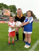 21 July 2013; Aoife McIlroy, from Tydavnet, Co. Monaghan, and Eoin McQuade, from Omagh, Co. Tyrone, are pictured at the Electric Ireland Ulster GAA Minor Football Championship Final, where they were the official ball-carriers and had the honour of presenting the match ball to the referee before the game. Aoife and Eoin won their prizes through Electric Ireland Facebook page www.facebook.com/ElectricIreland, Electric Ireland Ulster GAA Football Minor Championship Final, Monaghan v Tyrone, St Tiernach's Park, Clones, Co. Monaghan. Picture credit: Oliver McVeigh / SPORTSFILE