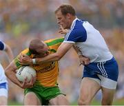 21 July 2013; Neil Gallagher, Donegal, in action against Owen Lennon, Monaghan. Ulster GAA Football Senior Championship Final, Donegal v Monaghan, St Tiernach's Park, Clones, Co. Monaghan. Picture credit: Oliver McVeigh / SPORTSFILE