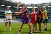 22 July 2013; In attendance at the launch of the M.Donnelly GAA All Ireland Poc Fada Finals are Deirdre Colfer, Wexford, showing off her skills to, from left to right, Catriona McCrickard, Down, Niamh Mackin, Louth, Bronagh Mone, Armagh, and Catriona Daly, Galway. Croke Park, Dublin. Picture credit: David Maher / SPORTSFILE