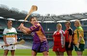 22 July 2013; In attendance at the launch of the M.Donnelly GAA All Ireland Poc Fada Finals are Deirdre Colfer, Wexford, showing off her skills to, from left to right, Catriona McCrickard, Down, Niamh Mackin, Louth, Bronagh Mone, Armagh, and Catriona Daly, Galway. Croke Park, Dublin. Picture credit: David Maher / SPORTSFILE
