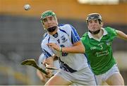 23 July 2013; Cormac Curran, Waterford, in action against Richard English, Limerick. Electric Ireland Munster GAA Hurling Minor Championship Final Replay, Limerick v Waterford, Semple Stadium, Thurles, Co. Tipperary. Picture credit: Barry Cregg / SPORTSFILE