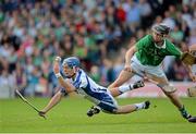 23 July 2013; Patrick Curran, Waterford, in action against Lorcan Lyons, Limerick. Electric Ireland Munster GAA Hurling Minor Championship Final Replay, Limerick v Waterford, Semple Stadium, Thurles, Co. Tipperary. Picture credit: Barry Cregg / SPORTSFILE