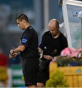 23 July 2013; Referee Tom Connolly, right, adjusts the wires for 4th official Adriano Reale, who replaced him as referee during the second half. EA Sports Quarter-Final, Shamrock Rovers v St. Patrick's Athletic, Tallaght Stadium, Tallaght, Dublin. Picture credit: David Maher / SPORTSFILE