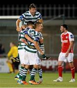 23 July 2013; Billy Dennehy, hidden, Shamrock Rovers, celebrates after scoring his side's second goal with team-mates Shane Robinson and James Chambers. EA Sports Quarter-Final, Shamrock Rovers v St. Patrick's Athletic, Tallaght Stadium, Tallaght, Dublin. Picture credit: David Maher / SPORTSFILE