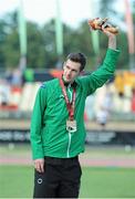 24 July 2013; Team Ireland’s Michael McKillop, from Newtownabbey, Co. Antrim, celebrates with his gold medal after winning the Men’s 1500 – T38 final, in a championship record time of 4:10.17. 2013 IPC Athletics World Championships, Stadium Parilly, Lyon, France. Picture credit: John Paul Thomas / SPORTSFILE