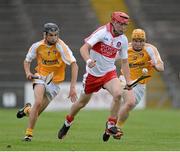 24 July 2013; Ciaran Lynch, Derry, in action against David Kearney, left, and Chris McGuinness, Antrim. Bord Gáis Energy Ulster GAA Hurling Under 21 Championship Final, Antrim v Derry, Casement Park, Belfast, Co. Antrim. Picture credit: Oliver McVeigh / SPORTSFILE
