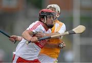 24 July 2013; Enna Cassidy, Derry, in action against Jackson McGreevey, Antrim. Bord Gáis Energy Ulster GAA Hurling Under 21 Championship Final, Antrim v Derry, Casement Park, Belfast, Co. Antrim. Picture credit: Oliver McVeigh / SPORTSFILE
