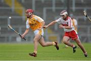 24 July 2013; Michael Bradley, Antrim, in action against Tiernan McCloskey, Derry. Bord Gáis Energy Ulster GAA Hurling Under 21 Championship Final, Antrim v Derry, Casement Park, Belfast, Co. Antrim. Picture credit: Oliver McVeigh / SPORTSFILE
