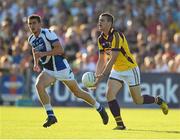 20 July 2013; Adrian Flynn, Wexford, in action against Colm Begley, Laois. GAA Football All-Ireland Senior Championship Round 3, Wexford v Laois, Wexford Park, Wexford Picture credit: David Maher / SPORTSFILE