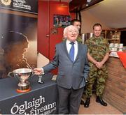 25 July 2013; President of Ireland and Commander-in-chief of the Irish Defence Forces Michael D. Higgins holds the Cunningham cup as he speaks to dignitaries before the game. Cunningham Cup Final, Sixth Infantry Battalion v Third Infantry Battalion, Tolka Park, Dublin. Picture credit: Barry Cregg / SPORTSFILE