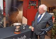 25 July 2013; President of Ireland and Commander-in-chief of the Irish Defence Forces Michael D. Higgins looks at the Cunningham cup before the game. Cunningham Cup Final, Sixth Infantry Battalion v Third Infantry Battalion, Tolka Park, Dublin. Picture credit: Barry Cregg / SPORTSFILE