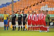 25 July 2013; Players and officials stand for a minute's silence for Private Patrick Conlon of the 28th Infantry Battalion. Cunningham Cup Final, Sixth Infantry Battalion v Third Infantry Battalion, Tolka Park, Dublin. Picture credit: Barry Cregg / SPORTSFILE