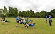 25 July 2013; Leinster coaches Tom McKeown, right, and Colm Finnegan instruct children during a drill at the Leinster School of Excellence. The King's Hospital, Palmerstown, Dublin. Picture credit: Barry Cregg / SPORTSFILE
