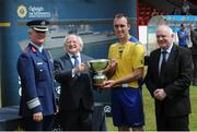 25 July 2013; President of Ireland and Commander-in-chief of the Irish Defence Forces Michael D. Higgins presents Sixth Infantry Battalion captain Mark McConnell with the Cunningham cup in the presence of Major General Ralph James, D Cos, Ops, left, and FAI President Paddy McCaul. Cunningham Cup Final, Sixth Infantry Battalion v Third Infantry Battalion, Tolka Park, Dublin. Picture credit: Barry Cregg / SPORTSFILE