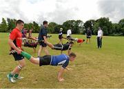 25 July 2013; Leinster coaches Stephen Coy and Victor Ball, far right, instruct children during a drill at the Leinster School of Excellence. The King's Hospital, Palmerstown, Dublin. Picture credit: Barry Cregg / SPORTSFILE