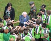 25 July 2013; President of Ireland Michael D. Higgins greets children at an eFlow FAI Summer Soccer School at Shelbourne FC. Tolka Park, Dublin. Picture credit: Barry Cregg / SPORTSFILE