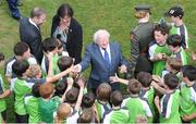 25 July 2013; President of Ireland Michael D. Higgins greets children at an eFlow FAI Summer Soccer School at Shelbourne FC. Tolka Park, Dublin. Picture credit: Barry Cregg / SPORTSFILE