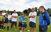 25 July 2013; Leinster player Steve Crosbie, right, and coach Ben Armstrong give some coaching advice to Participants at the Leinster School of Excellence. The King's Hospital, Palmerstown, Dublin. Picture credit: Barry Cregg / SPORTSFILE