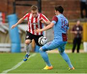 25 July 2013; Simon Madden, Derry City, in action against Aykut Akgun, Trabzonspor. UEFA Europa League Second Qualifying Round, 2nd leg, Derry City v Trabzonspor, The Brandywell, Derry. Picture credit: Oliver McVeigh / SPORTSFILE