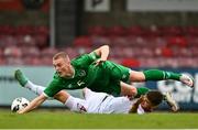 13 October 2021; Oliwier Slawinski of Poland is tackled by Cathal Heffernan of Republic of Ireland resulting in a penalty during the UEFA U17 Championship Qualifying Round Group 5 match between Republic of Ireland and Poland at Turner's Cross in Cork. Photo by Eóin Noonan/Sportsfile