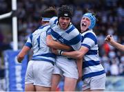 13 October 2021; Donnacha McGuire of Blackrock College, centre, celebrates with team-mates Donie Grehan, left, and Jack Pollard after scoring his side's fifth try during the Bank of Ireland Leinster Schools Junior Cup semi-final match between Blackrock College and Terenure College at Energia Park in Dublin. Photo by Piaras Ó Mídheach/Sportsfile