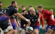 13 October 2021; Jeremy Loughman, centre, is tackled by Tadhg Beirne, left, and Mike Haley during Munster rugby squad training at the University of Limerick in Limerick. Photo by Brendan Moran/Sportsfile