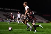 15 October 2021; Liam Burt of Bohemians in action against Greg Sloggett of Dundalk during the SSE Airtricity League Premier Division match between Bohemians and Dundalk at Dalymount Park in Dublin. Photo by Ben McShane/Sportsfile