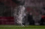 15 October 2021; A flare is thrown onto the pitch by supporters during the SSE Airtricity League Premier Division match between Bohemians and Dundalk at Dalymount Park in Dublin. Photo by Ben McShane/Sportsfile