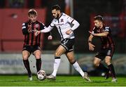 15 October 2021; Sami Ben Amar of Dundalk in action against Conor Levingston, left, and Tyreke Wilson of Bohemians during the SSE Airtricity League Premier Division match between Bohemians and Dundalk at Dalymount Park in Dublin. Photo by Ben McShane/Sportsfile