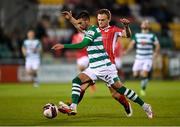 15 October 2021; Danny Mandroiu of Shamrock Rovers evades the tackle of Sligo Rovers' David Cawley on his way to scoring his side's first goal during the SSE Airtricity League Premier Division match between Shamrock Rovers and Sligo Rovers at Tallaght Stadium in Dublin. Photo by Seb Daly/Sportsfile