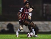 15 October 2021; Promise Omochere of Bohemians in action against Darragh Leahy of Dundalk during the SSE Airtricity League Premier Division match between Bohemians and Dundalk at Dalymount Park in Dublin. Photo by Ben McShane/Sportsfile