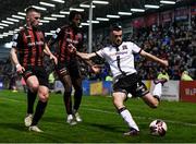 15 October 2021; Michael Duffy of Dundalk in action against Andy Lyons, left, and Promise Omochere of Bohemians during the SSE Airtricity League Premier Division match between Bohemians and Dundalk at Dalymount Park in Dublin. Photo by Ben McShane/Sportsfile