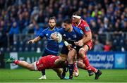 16 October 2021; Rónan Kelleher of Leinster is tackled by WillGriff John, left, and Aaron Shingler of Scarlets during the United Rugby Championship match between Leinster and Scarlets at the RDS Arena in Dublin. Photo by Ramsey Cardy/Sportsfile