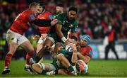 16 October 2021; Conor Oliver of Connacht is supported by team-mate Bundee Aki as he is tackled by Tadhg Beirne of Munster during the United Rugby Championship match between Munster and Connacht at Thomond Park in Limerick. Photo by David Fitzgerald/Sportsfile