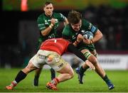 16 October 2021; Cian Prendergast of Connacht is tackled by Chris Cloete of Munster during the United Rugby Championship match between Munster and Connacht at Thomond Park in Limerick. Photo by David Fitzgerald/Sportsfile
