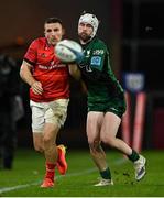 16 October 2021; Andrew Conway of Munster and Mack Hansen of Connacht during the United Rugby Championship match between Munster and Connacht at Thomond Park in Limerick. Photo by Piaras Ó Mídheach/Sportsfile