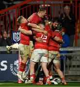16 October 2021; Munster players celebrate with Chris Cloete, right, after he scored their first try during the United Rugby Championship match between Munster and Connacht at Thomond Park in Limerick. Photo by Piaras Ó Mídheach/Sportsfile