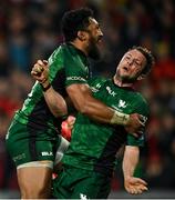 16 October 2021; Jack Carty of Connacht is caught by surprise by team-mate Bundee Aki, left, while celebrating their side's second try during the United Rugby Championship match between Munster and Connacht at Thomond Park in Limerick. Photo by Piaras Ó Mídheach/Sportsfile