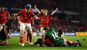 16 October 2021; Diarmuid Barron of Munster scores his side's second try despite the efforts of John Porch of Connacht during the United Rugby Championship match between Munster and Connacht at Thomond Park in Limerick. Photo by David Fitzgerald/Sportsfile