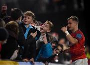 16 October 2021; Craig Casey of Munster with supporters after the United Rugby Championship match between Munster and Connacht at Thomond Park in Limerick. Photo by David Fitzgerald/Sportsfile