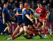 16 October 2021; Josh van der Flier of Leinster is tackled by Sam Lousi of Scarlets during the United Rugby Championship match between Leinster and Scarlets at the RDS Arena in Dublin. Photo by Seb Daly/Sportsfile