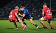 16 October 2021; Jordan Larmour of Leinster in action against Ioan Nicholas, left, and Shaun Evans of Scarlets during the United Rugby Championship match between Leinster and Scarlets at the RDS Arena in Dublin. Photo by Seb Daly/Sportsfile