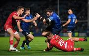 16 October 2021; Cian Healy of Leinster is tackled by Kieran Hardy, left, and Shaun Evans of Scarlets during the United Rugby Championship match between Leinster and Scarlets at the RDS Arena in Dublin. Photo by Seb Daly/Sportsfile